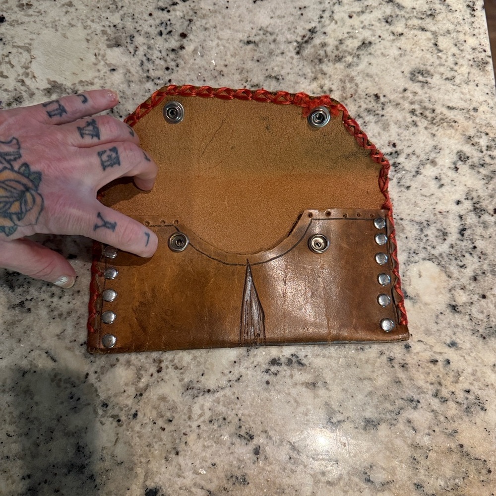 Brown hand tooled leather wallet